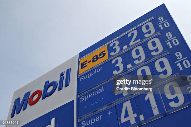 Gas prices, including E85, a blend of 85 percent ethanol and gasoline, top, are displayed on a sign outside a Mobil station in Birmingham, Michigan,...