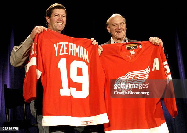 Sun Microsystems Chairman & CEO Scott McNealy, left, and Microsoft Corp CEO Steve Ballmer show off autographed hockey jerseys they presented to each...