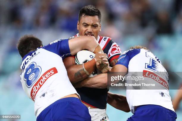 Zane Tetevano of the Roosters is tackled by the Bulldogs defence during the round seven NRL match between the Canterbury Bulldogs and the Sydney...