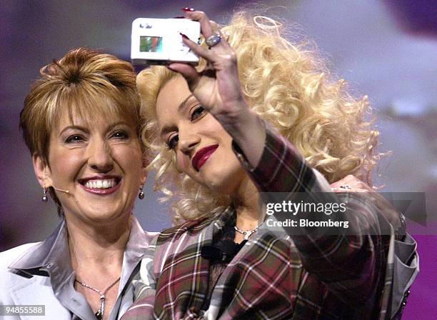 Carly Fiorina, left, CEO, Hewlett Packard introduces the company's new digital camera with the help of No Doubt lead singer Gwen Stefani, at the...