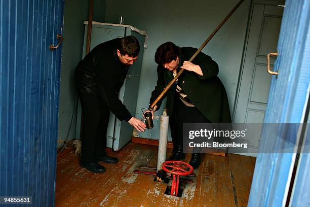 Staff from the Baikalsk pulp and paper plant, owned by Continental Management and the Russian government, collect water samples from a reservoir in...