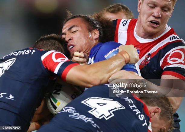 Raymond Faitala of the Bulldogs is tackled by Roosters defence during the round seven NRL match between the Canterbury Bulldogs and the Sydney...