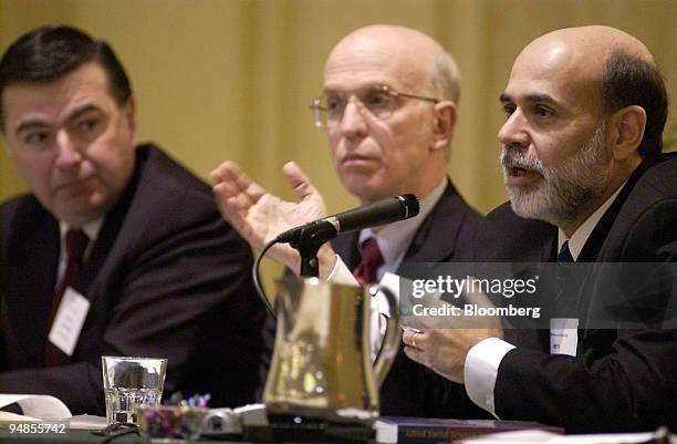 Federal Reserve Governor Ben Bernanke, right, speaks on a panel along with Philadelphia Federal Reserve Bank President Anthony Santomero, left, and...