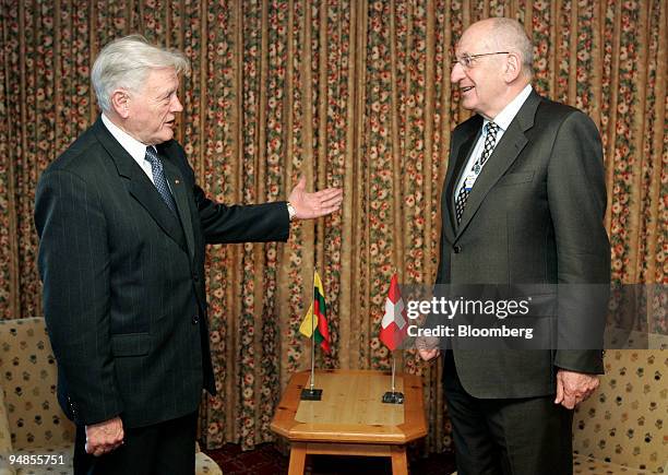 Pascal Couchepin, president of Switzerland and federal councillor of home affairs, right, speaks with Valdas Adamkus, Lithuania's president during a...