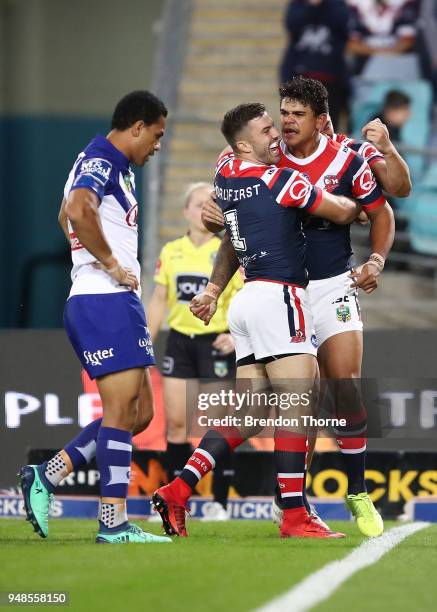 Latrell Mitchell of the Roosters celebrates with team mates after scoring a try during the round seven NRL match between the Canterbury Bulldogs and...