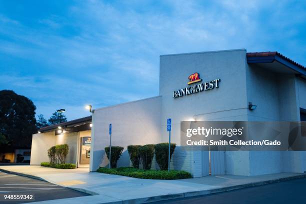 Facade with sign at night at Bank of the West branch, a subsidiary of BNP Paribas, in downtown Dublin, California, April 9, 2018.