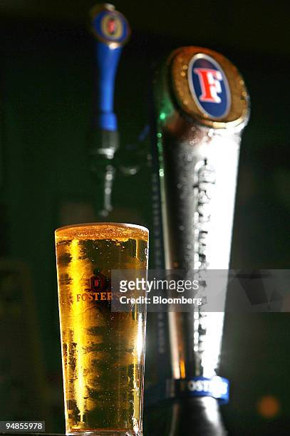 Pint of Fosters lager sits on a bar at a public house for this still life image in Hornchurch, Essex, U.K., on Tuesday, Aug 26, 2008. Heineken NV,...