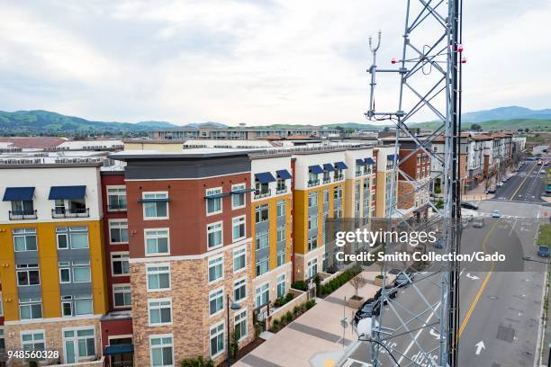 Aerial view of rows of new housing with a cellular phone tower in the foreground near the Bay Area Rapid Transit station in downtown Dublin,...