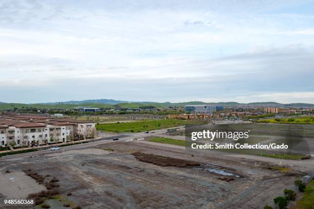 Aerial view of new housing and commercial construction and open fields, many of which have been scheduled for new construction projects, in Dublin,...