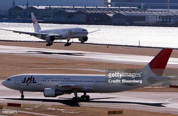 Japan Airlines Co. Ltd. Passenger jets are pictured on the tarmac at Haneda Airport in Tokyo, Saturday, February 4, 2006. Japan Airlines Corp.'s...
