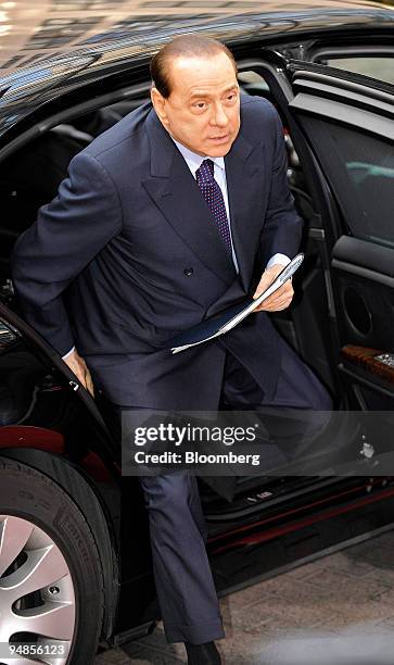 Silvio Berlusconi, Italy's prime minister, arrives for an informal summit of European heads of state at the EU Council building in Brussels, Belgium,...