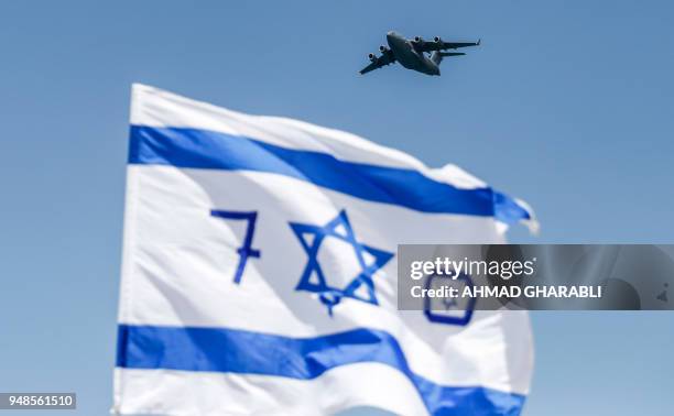 Made Israeli air force C-17 Globemaster III transport aircraft flies over during an air show as part of the 70th Independence Day celebrations on...
