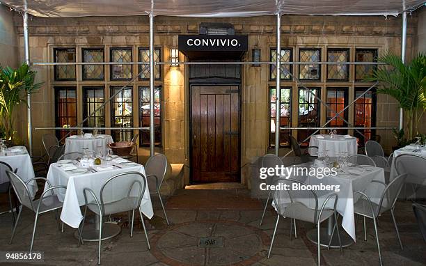 Tables are set outside of Convivio at Tudor City in New York, U.S., on Monday, Aug. 25, 2008. Michael White is the demon chef of Tudor City. Convivio...