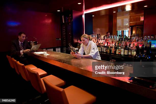 Patron sits at the bar of Convivio in New York, U.S., on Monday, Aug. 25, 2008. Michael White is the demon chef of Tudor City. Convivio is his den of...
