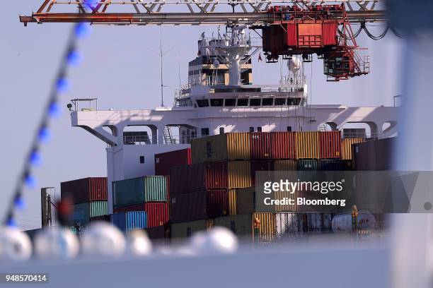 Shipping containers sit on board a cargo ship at the Eurogate Terminal at the Port of Hamburg in Hamburg, Germany, on Wednesday, April 18, 2018....