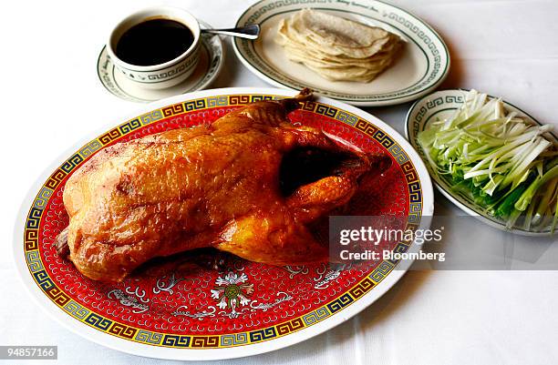 Meal of duck, hoisin sauce, pancakes and spring onions is arranged for a photo at Peking Gourmet, a restaurant in Falls Church, Virginia, U.S., on...