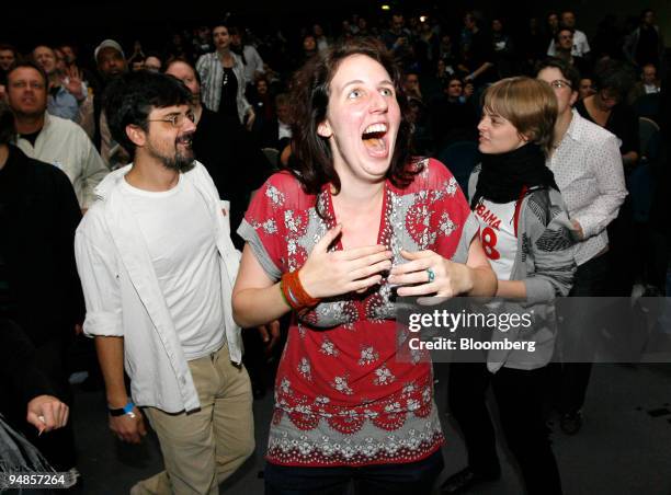 Supporters of Democratic president-elect Barack Obama celebrate in reaction to the first announcements of Obama winning the U.S. Presidential...