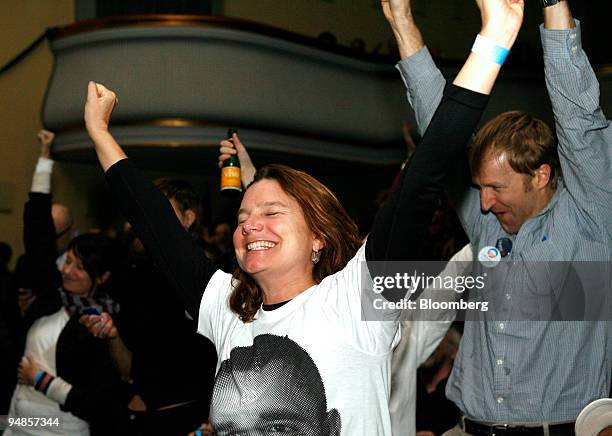 Supporters of Democratic president-elect Barack Obama celebrate in reaction to the first announcements of Obama winning the U.S. Presidential...
