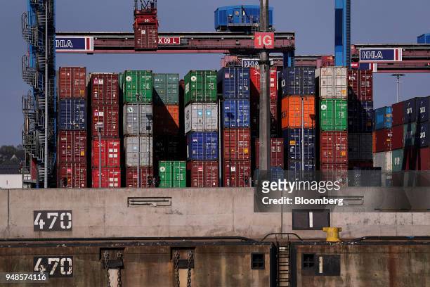 Shipping containers sit on the dockside at Terminal Burchardkai in the Port of Hamburg in Hamburg, Germany, on Wednesday, April 18, 2018. German...