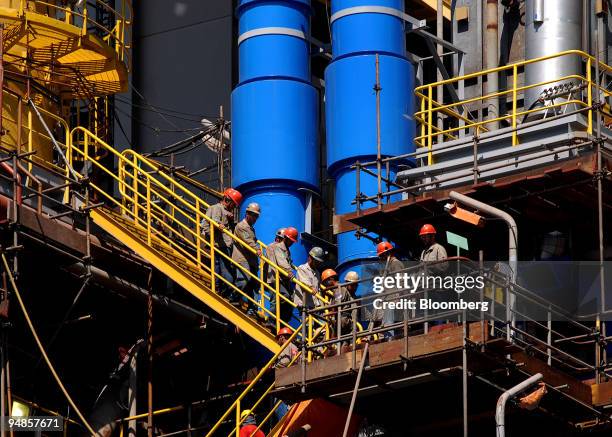 Rig workers stair down from the Petroleo Brasileiro SA P-51 oil platform at the Keppel-Fels Shipyard in Angra dos Reis, Rio de Janeiro in Brazil, on...