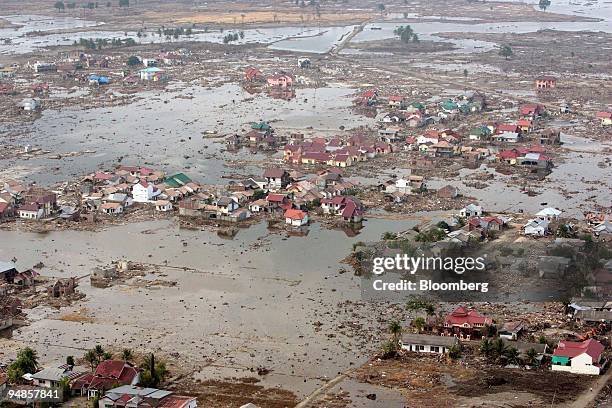 Large swathes of the provincial capital of Indonesia, Banda Aceh lies in ruin on Monday, January 3, 2005. U.S. Navy helicopters stationed on the USS...