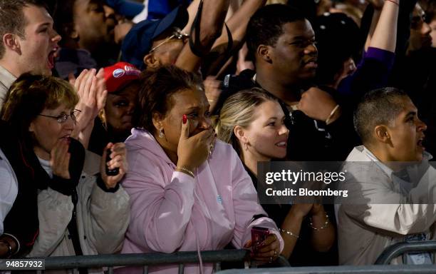 Supporters of Democratic president-elect Barack Obama react to the news of his election win during a rally in Grant Park in Chicago, Illinois, U.S.,...