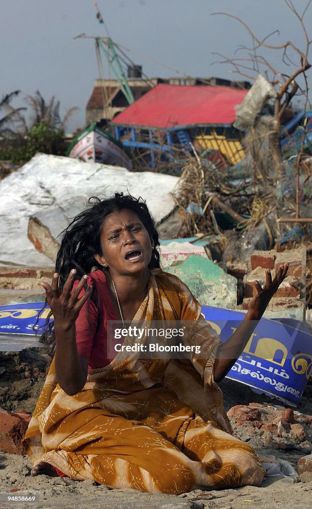 A woman wails on the beach at Nagapattinam Friday, December