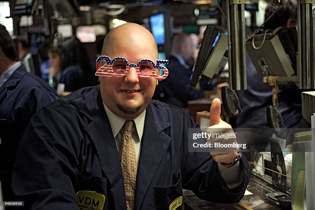 Trading Assistant John Urbanowicz poses with a pair of 2005