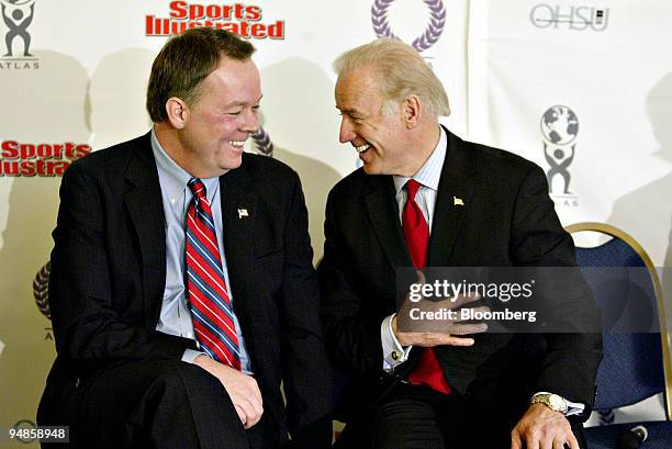 Deputy Director of the White House Office of National Drug Control Policy Scott Burns, left, shares a laugh with Senator Joseph Biden during an event...