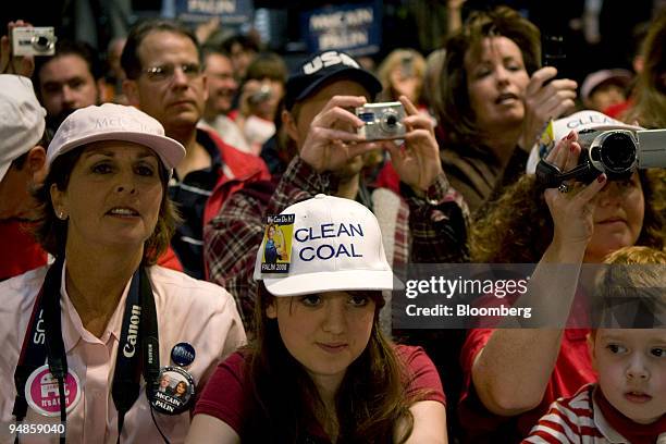 Supporters of Senator John McCain of Arizona, Republican presidential candidate, listen to him speak during a campaign rally at the Strath Haven High...