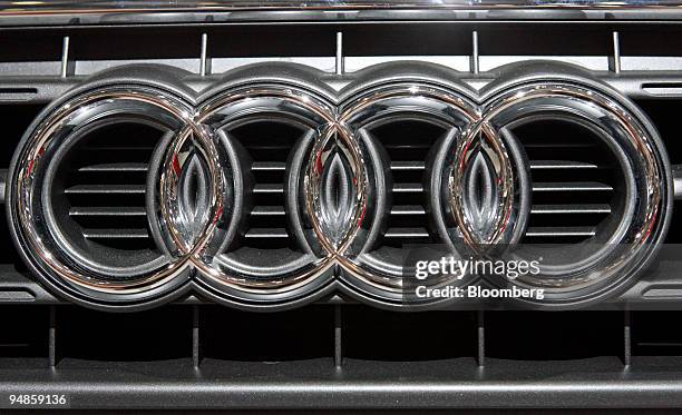 An Audi logo hangs on an Audi A4 automobile at Volkswagen AG's annual shareholder meeting in Hamburg, Germany, on Thursday, April 24, 2008. Porsche...