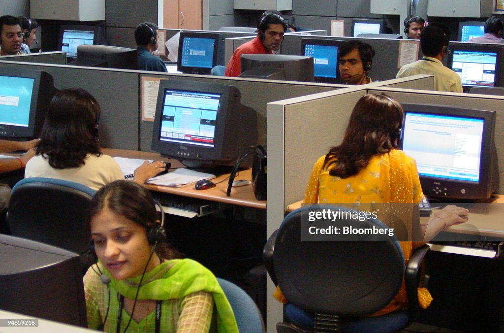 Agents attend to customer calls at New Delhi-based NIIT Ltd.
