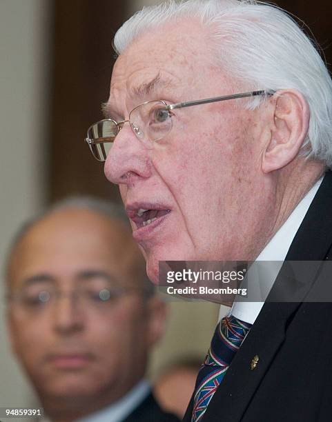 Ian Paisley, Northern Ireland's first minister, right, speaks as William C. Thompson, New York City comptroller, listens during a news conference in...