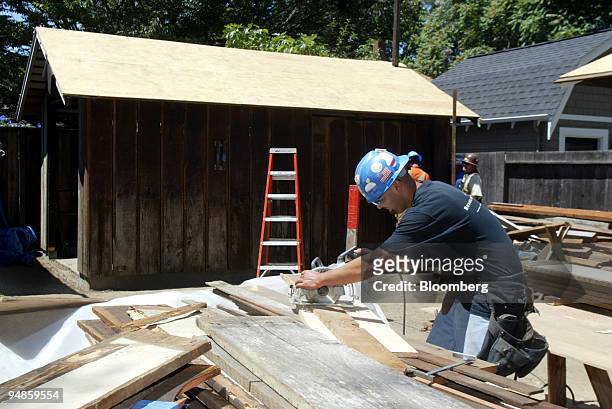 Ray Cordero Jr. Cuts wood near the 'HP garage' on the grounds of 367 Addison Ave. In Palo Alto, California Thursday, June 30, 2005. The garage was...