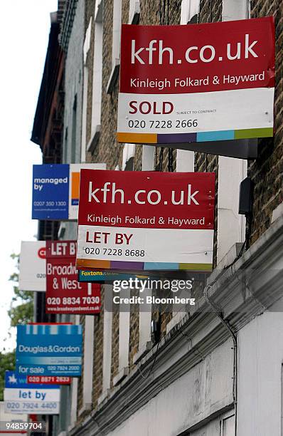 Collection of estate agents signs, showing residential properties for sale, to let, sold hang outside property in London, U.K., on Monday, Aug. 18,...