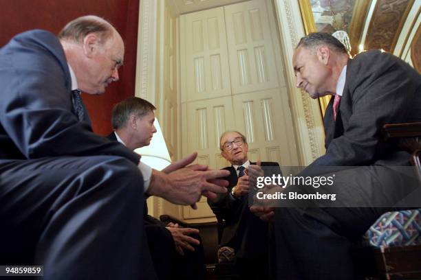 Treasury Secretary John Snow, left to right; Sen Lindsey Graham R-SC; FEC Chairman Alan Greenspan; and Sen Charles Schumer meet on Capitol Hill to...