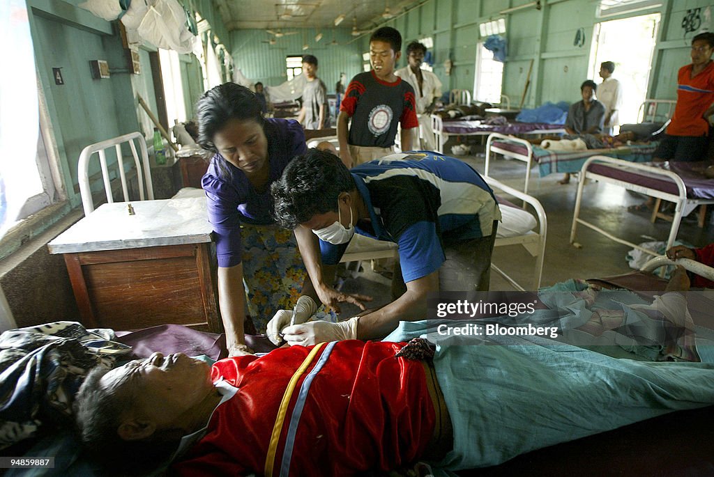An injured man receives stitches in a hospital in Car Nicoba