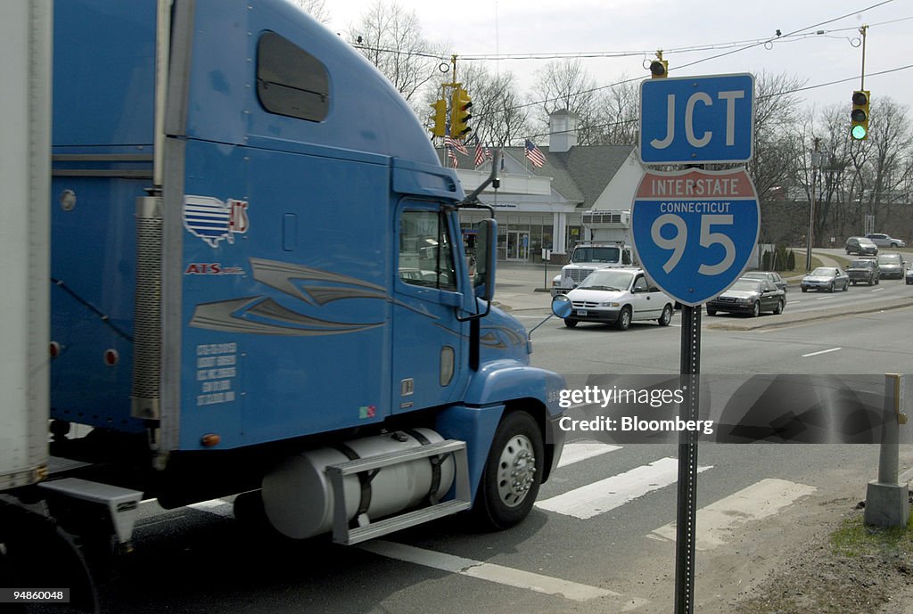 A truck drives by a sign for I-95 heading north in Bridgepor