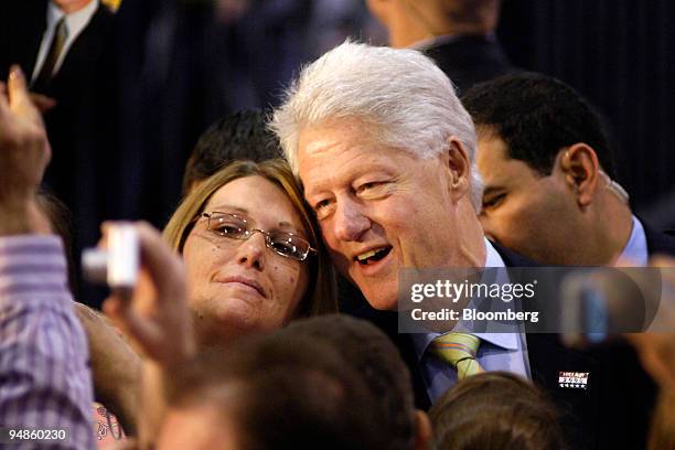 Former U.S. President Bill Clinton, right, husband of Hillary Clinton, U.S. Senator from New York and 2008 Democratic presidential candidate, poses...
