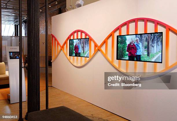 Client testimonials play on monitors in the Navigenics store in the SoHo neighborhood of New York, U.S., on Thursday, April 10, 2008. Navigenics...