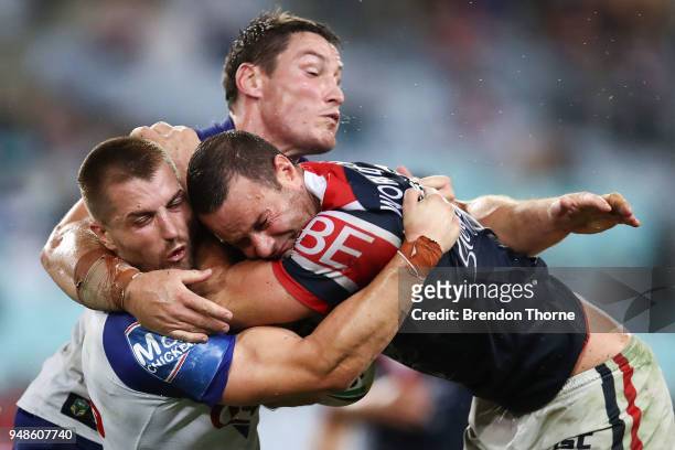 Boyd Cordner of the Roosters is tackled by Kieran Foran and Joshua Jackson of the Bulldogs during the round seven NRL match between the Canterbury...