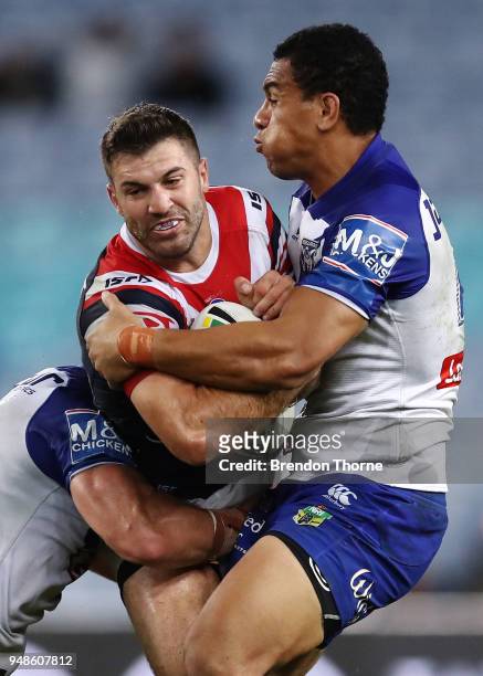 James Tedesco of the Roosters is tackled by the Bulldogs defence during the round seven NRL match between the Canterbury Bulldogs and the Sydney...