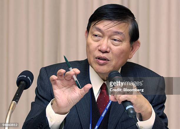 Semiconductor Manufacturing International Corp. Chief executive Richard Chang gestures as he answers a reporter's question at a press briefing in...