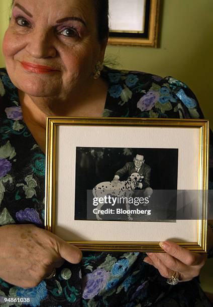 Marta Holgado shows a portrait of her alleged father, General Juan Domingo Peron at her home in Buenos Aires, Argentina on October 12, 2005. The 71...