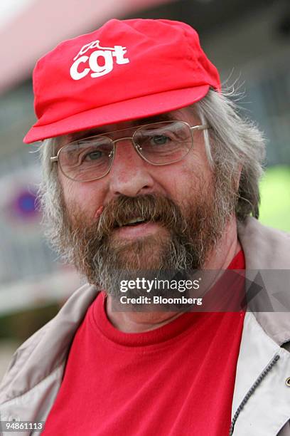 Serge Lor, delegate of Confederation Generale du Travail union , poses in front of Total oil refinery, in Gonfreville, near Le Havre, France, Friday,...