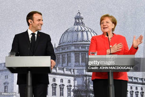 German Chancellor Angela Merkel and French President Emmanuel Macron give a joint press conference on April 19, 2018 in Berlin before holding talks...