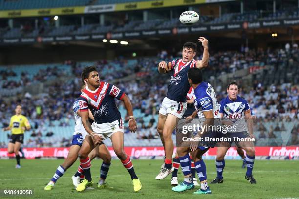 Joseph Manu of the Roosters jumps for a high ball during the round seven NRL match between the Canterbury Bulldogs and the Sydney Roosters at ANZ...