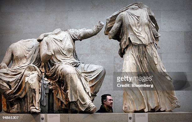 Visitor passes part of the Elgin Marbles collection at the British Museum in London, Monday, February 6, 2006. For more than 20 years, Greek...
