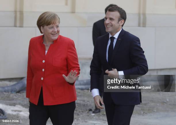 German Chancellor Angela Merkel and French President Emmanuel Macron arrive to visit the Humboldt Forum construction site on April 19, 2018 in...