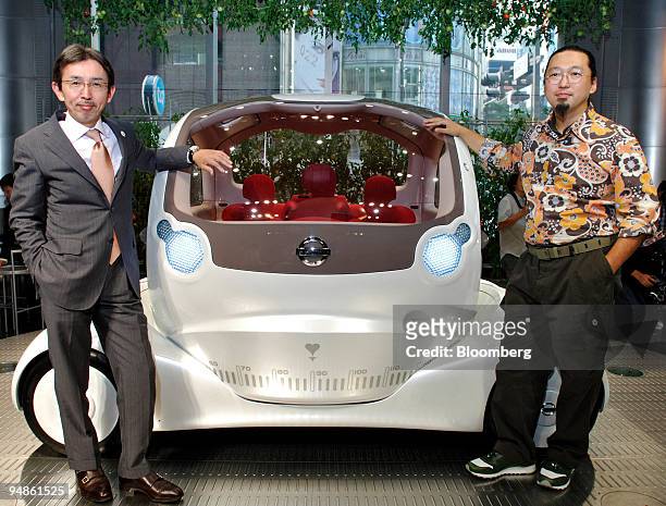 Nissan Motor Co. Chief designer Shiro Nakamura, left, and Artist Takashi Murakami, right, pose with the "Pivo" concept car at a press briefing in...